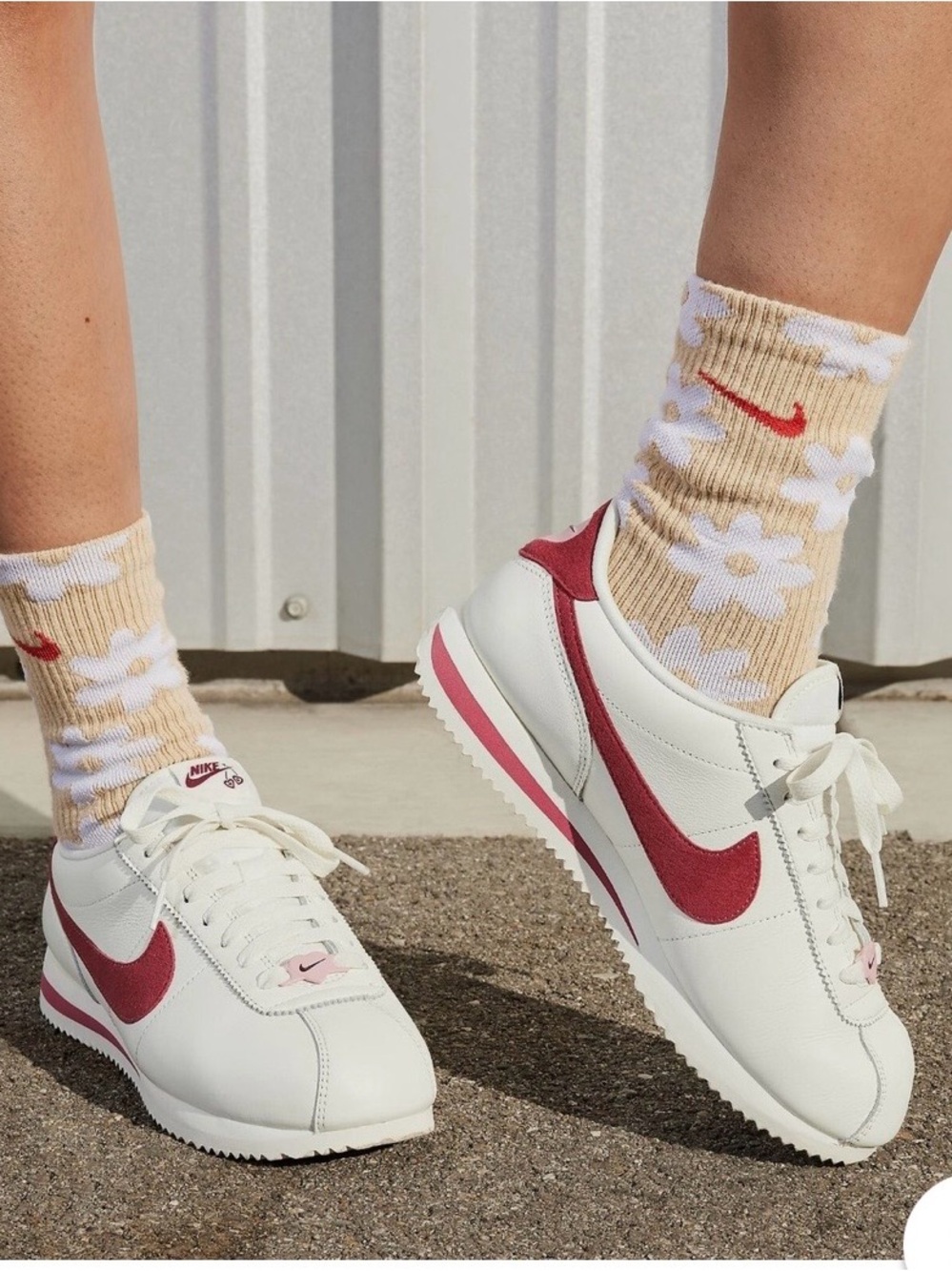 Nike Women's White Sneakers with Red Swoosh and Pink Midsole Stripe